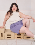 Ashley is wearing Trouser Shorts in Faded Grape and Sleeveless Turtleneck in vintage tee off-white