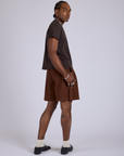 Pleated Trouser Shorts in Fudgesicle Brown angled back view of Pleated Trouser Shorts in Fudgesicle Brown