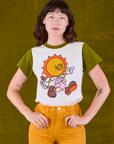 Alex is wearing Anniversary Tee in Walkin' On Sun Baby tucked into mustard yellow Work Shorts