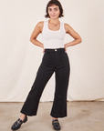 Soraya is 5'2" and wearing XXS Petite Western Pants in Basic Black paired with a Tank Top in vintage tee off-white