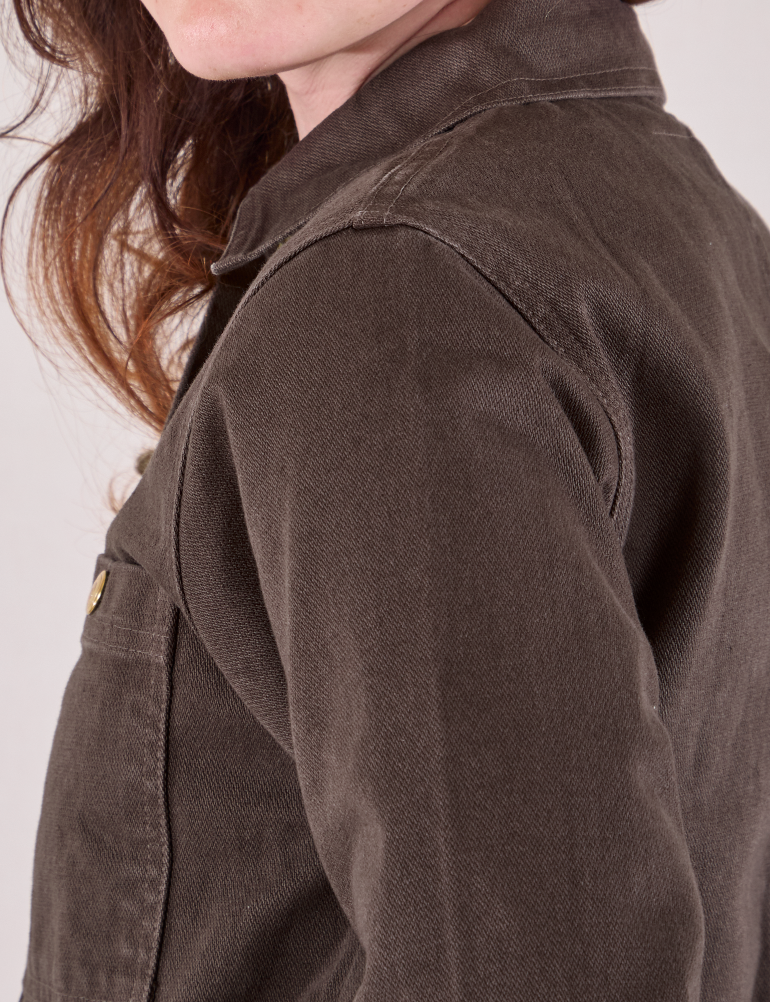 Denim Work Jacket in Espresso Brown shoulder close up on Alex