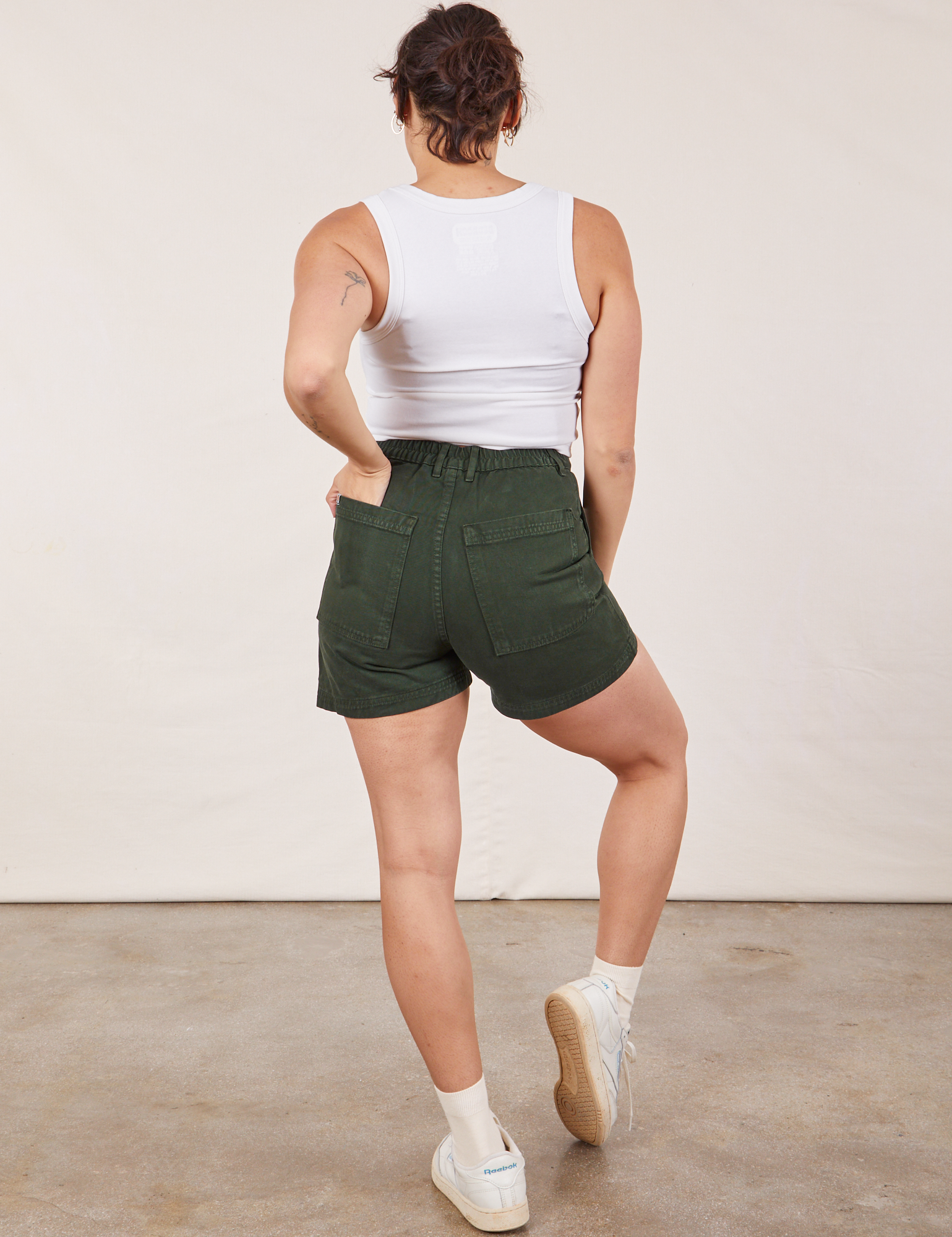 Back view of Classic Work Shorts in Swamp Green and Cropped Tank Top in vintage tee off-white Tiara