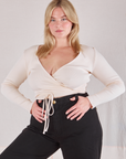 Lish is wearing Wrap Top in Vintage Tee Off-White and black Bell Bottoms
