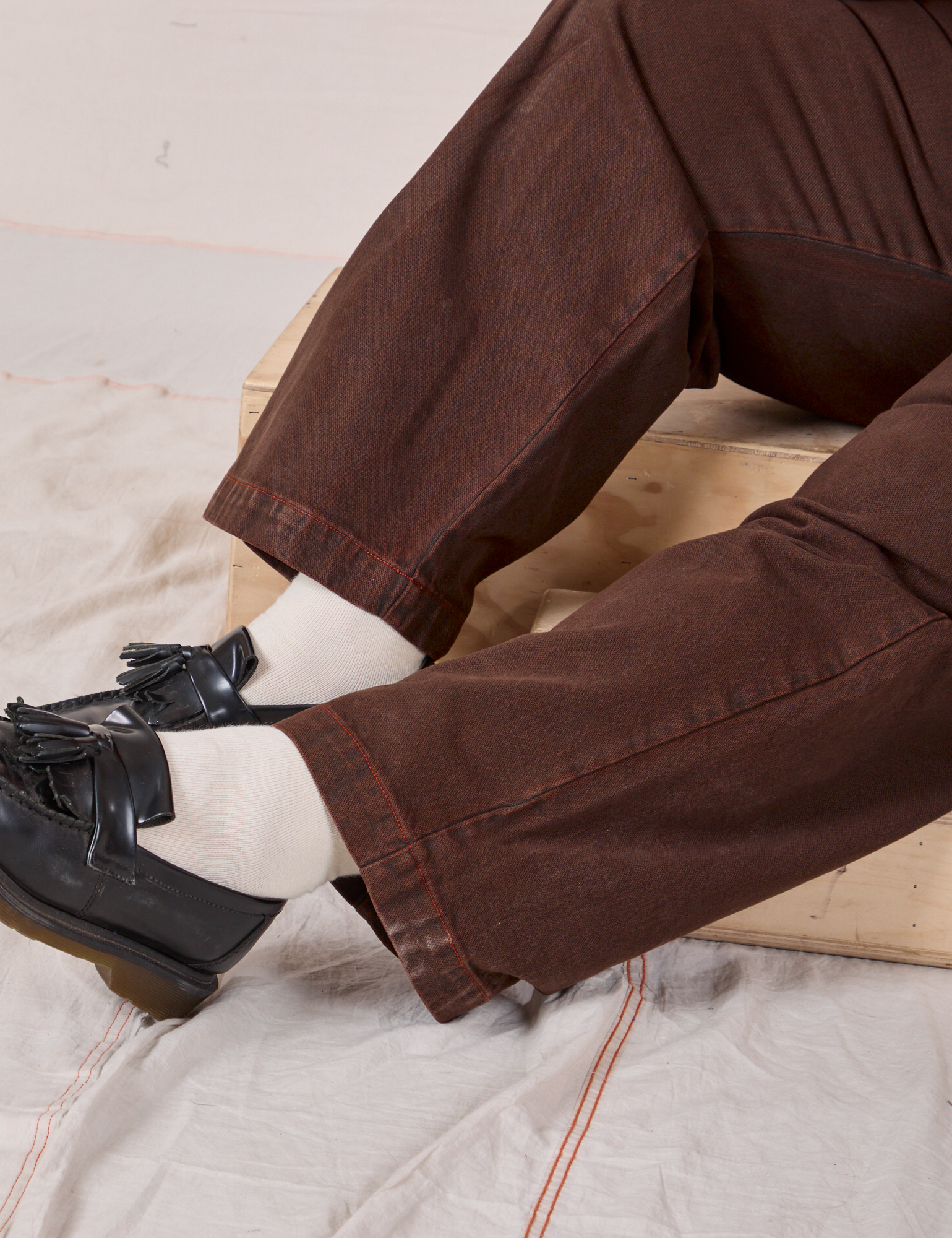 Overdyed Denim Trouser in Fudge pant leg close up on Morgan