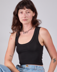 Alex is 5'8" and wearing P Cropped Tank Top in Basic Black