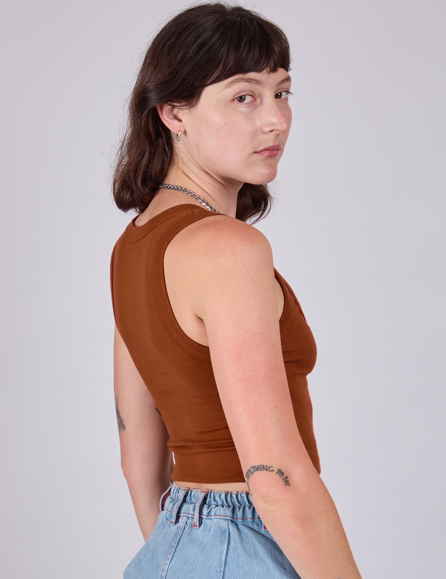 Cropped Tank Top in Burnt Terracotta side view on Alex