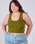 Ashley is 5'7" and wearing L Cropped Tank Top in Olive Green
