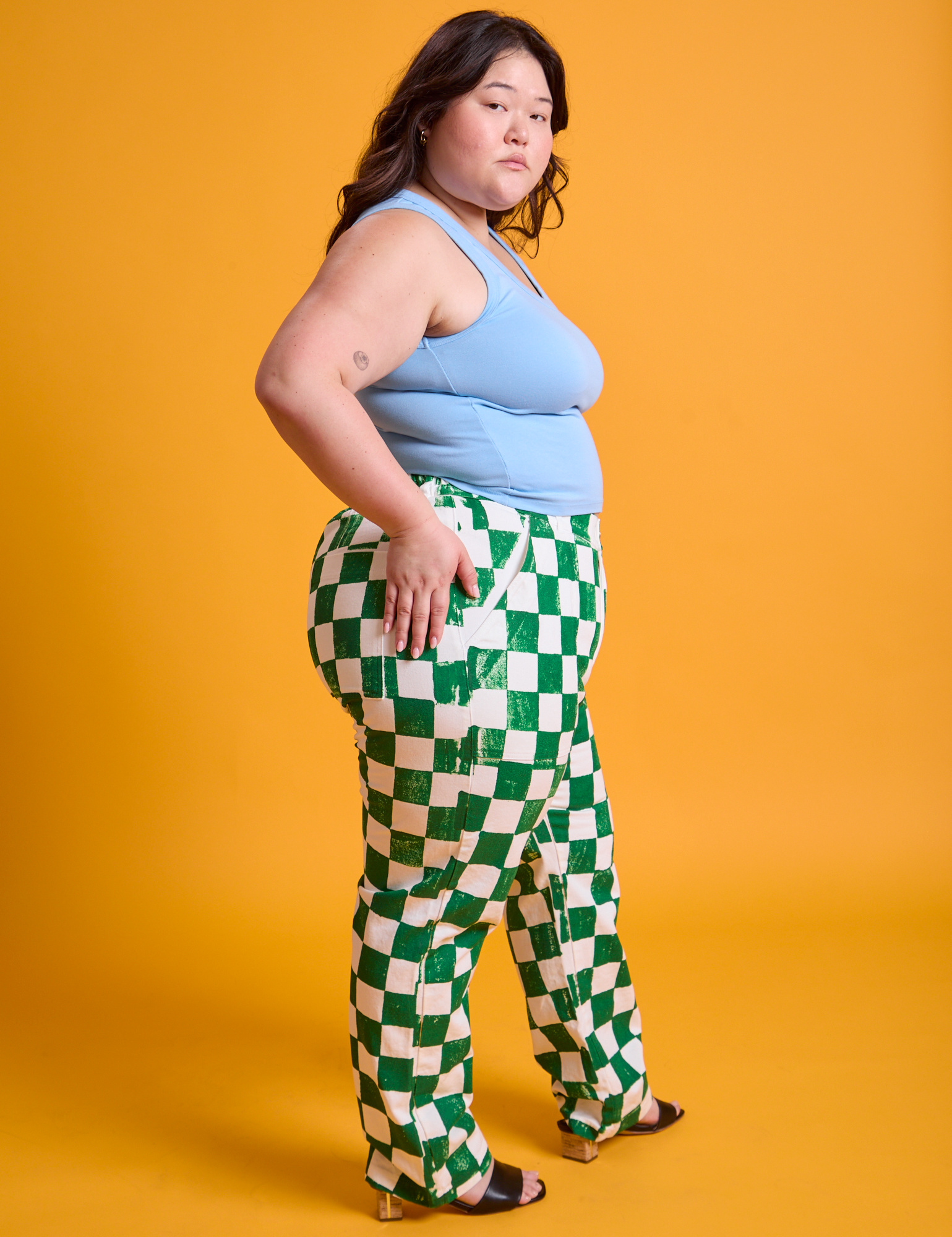 Side view of Checkerboard Work Pants in White/Green and baby blue Tank Top on Ashley
