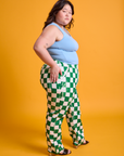 Side view of Checkerboard Work Pants in White/Green and baby blue Tank Top on Ashley