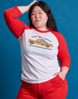 Ashley is 5'7" and wearing L Taxi Raglan Tee in NYC featuring a yellow taxi graphic