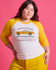Ashley is 5'7" and wearing L Taxi Raglan Tee in Toronto