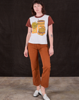 Alex is wearing Anniversary Tee in Fast Food paired with burnt terracotta Work Pants