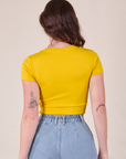 Baby Tee in Golden Yellow back view on Alex
