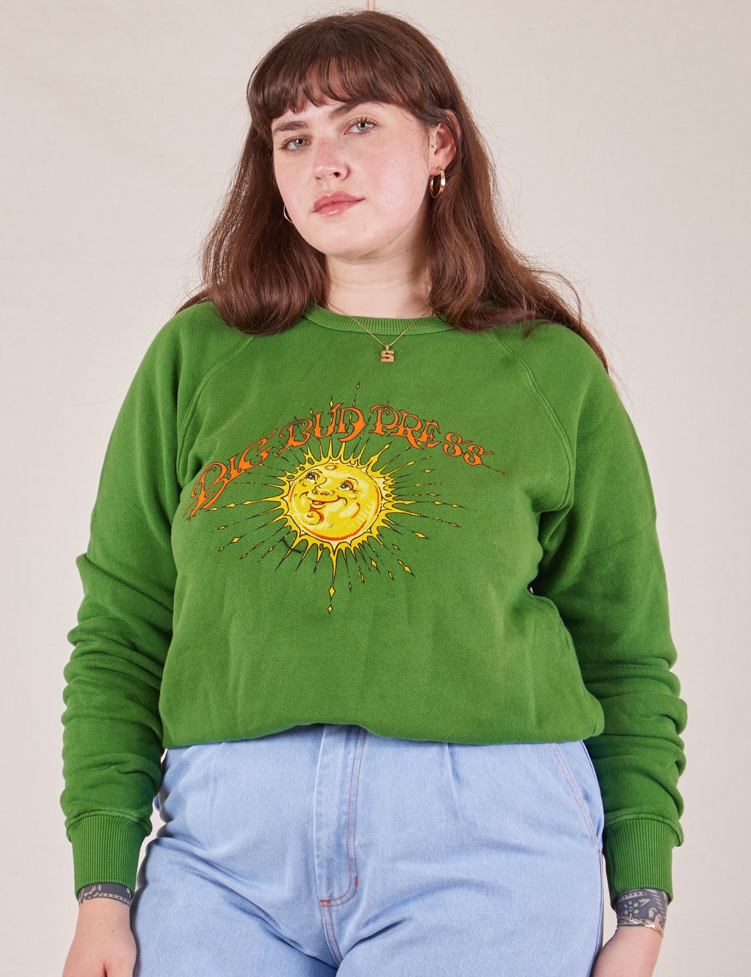 Sydney is 5&#39;9&quot; and wearing XS Bill Ogden&#39;s Sun Baby Crew in Lawn Green