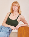 Margaret is wearing Cropped Cami in Swamp Green