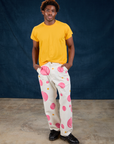 Isaac is 5'10" and wearing M Paintstamped Work Pants in Bubblegum