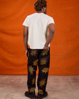 Back view of Paintstamped Work Pants in Explosion and Organic Vintage Tee in Vintage Off-White