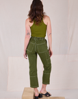 Back view of Railroad Carpenter Jeans in Summer Olive and muscle tee on Alex
