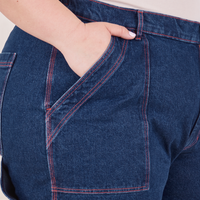 Carpenter Jeans in Dark Wash front pocket close up. Ashley has her hand in the pocket.