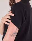 Cropped Burly Tee in Basic Black sleeve and shoulder side close up on Alex