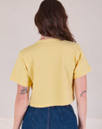 Cropped Burly Tee in Butter Yellow back view on Alex