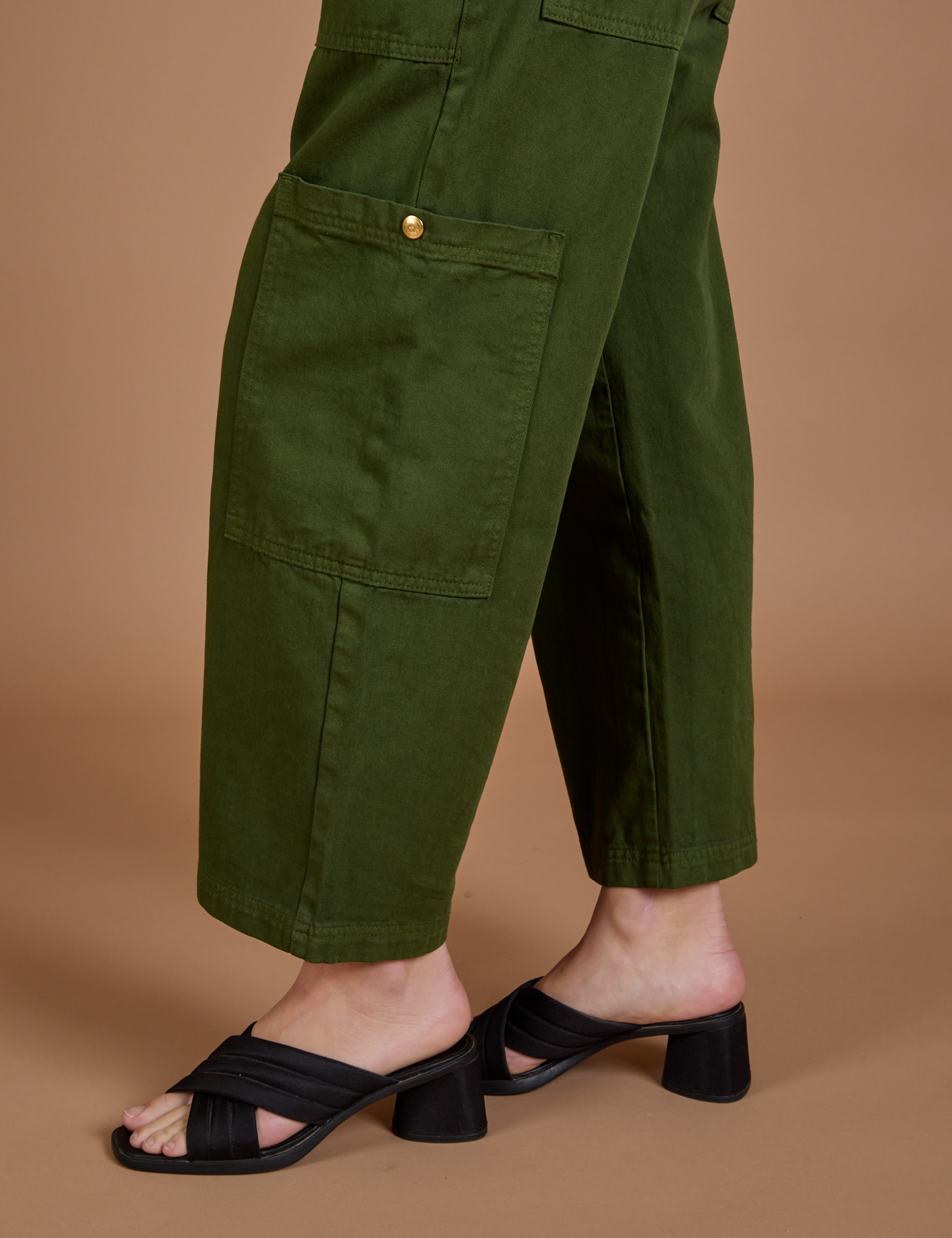 Drop Pocket Cargo Pants in Evergreen side pant leg close up on Alex