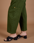Drop Pocket Cargo Pants in Evergreen side pant leg close up on Alex