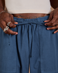 Close up of Jerrod holding the cotton drawstring