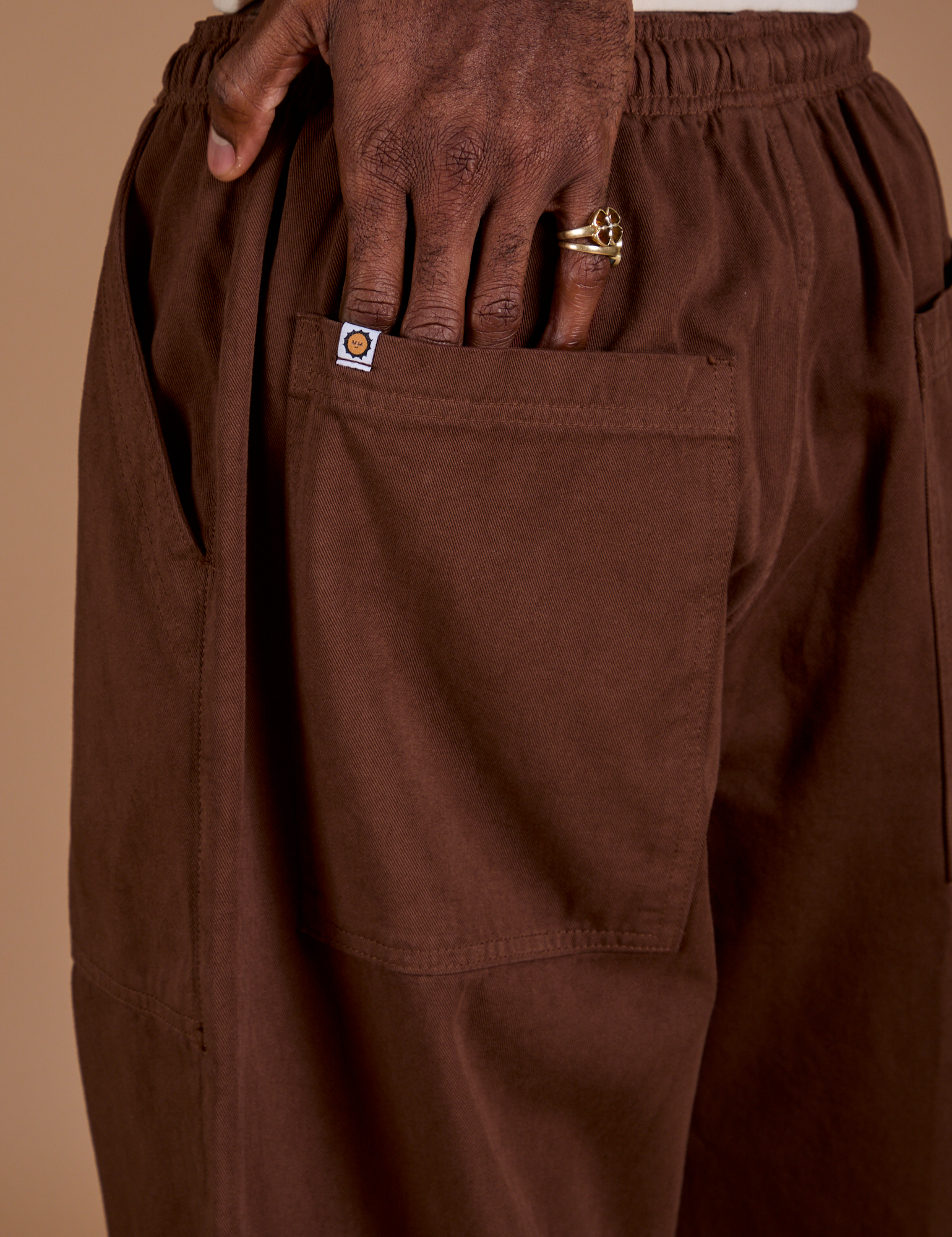 Drop Pocket Cargo Pants in Fudgesicle Brown back pocket close up