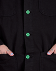 Ripstop Field Coat in Basic Black and green buttons close up on Sam