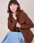 Alex is wearing Flannel Overshirt in Fudgesicle Brown