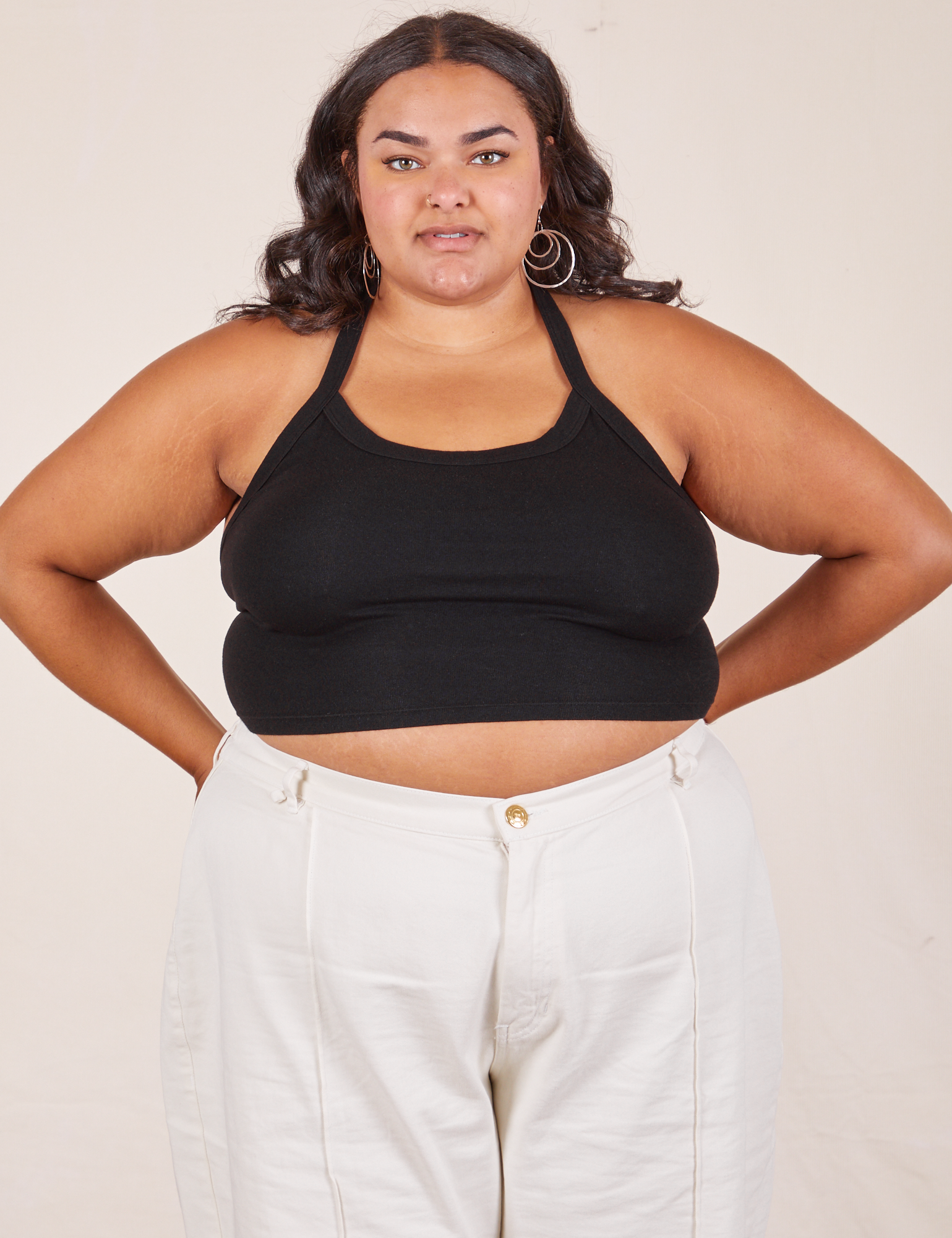Alicia is 5&#39;9&quot; and wearing XL Halter Top in Basic Black paired with vintage off-white Western Pants