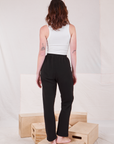 Back view of Rolled Cuff Sweat Pants in Basic Black and Cropped Tank in vintage tee off-white  on Alex