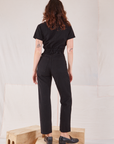 Heritage Short Sleeve Jumpsuit in Basic Black back view on Alex