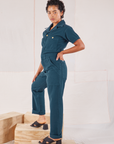 Heritage Short Sleeve Jumpsuit in Lagoon side view on Mika