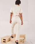 Heritage Short Sleeve Jumpsuit in Natural back view on Mika