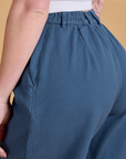 Angled back view close up of Heritage Wide Leg Trousers in French Blue on Alex