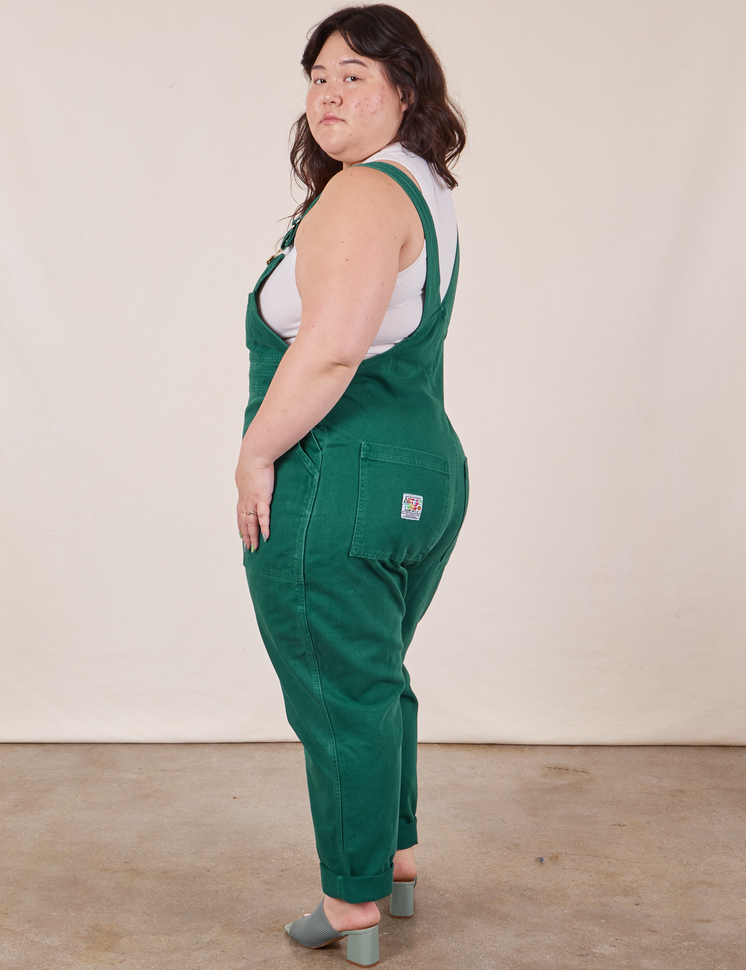 Side view of Original Overalls in Mono Hunter Green worn by Ashley
