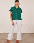 Tiara is wearing size XS Pantry Button-Up in Hunter Green paired with vintage off-white Western Pants