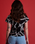Back view of Chain Link Vintage Tee in Basic Black on Alex