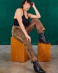 Tiara is wearing Leopard Work Pants and black Halter Top