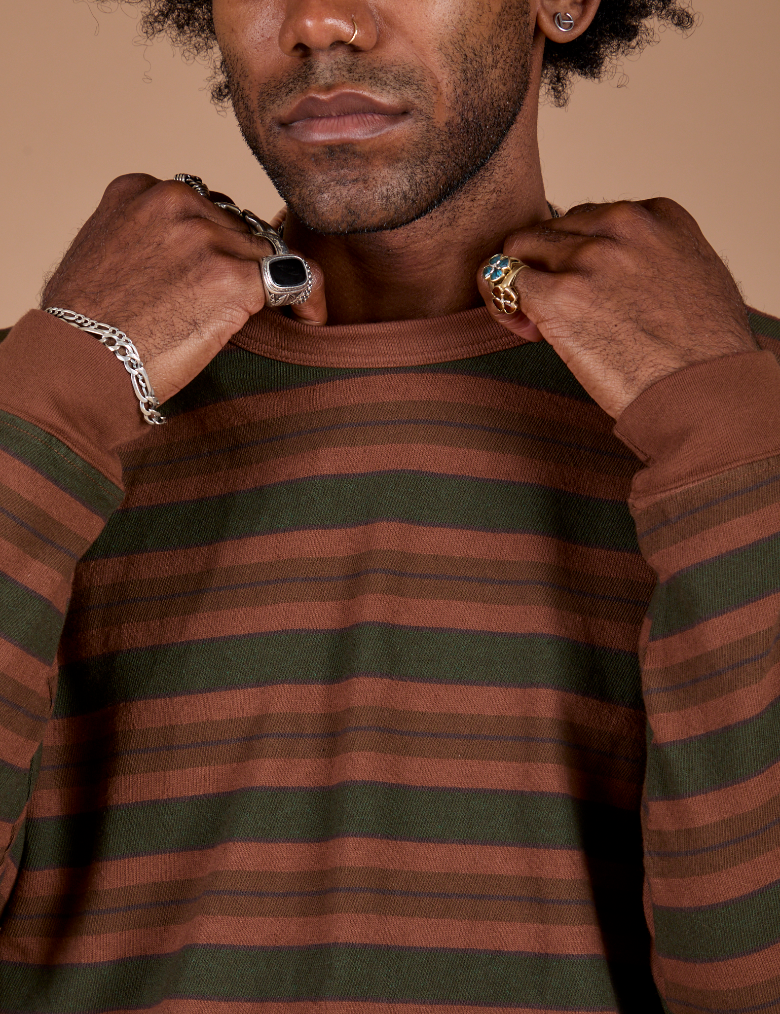 Long Sleeve Striped Burly Tee in Fudgesicle front close up with Jerrod holding the collar