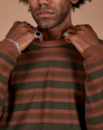 Long Sleeve Striped Burly Tee in Fudgesicle front close up with Jerrod holding the collar
