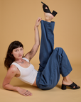 Alex is wearing Baggy Mid-Rise Trousers in French Blue and vintage tee white Cropped Tank