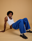 Baggy Mid-Rise Trousers in Royal Blue and vintage tee white Cropped Tank on Jerrod