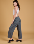 Side view of Baggy Mid-Rise Trousers in Slate Grey and vintage tee white Cropped Tank on Alex