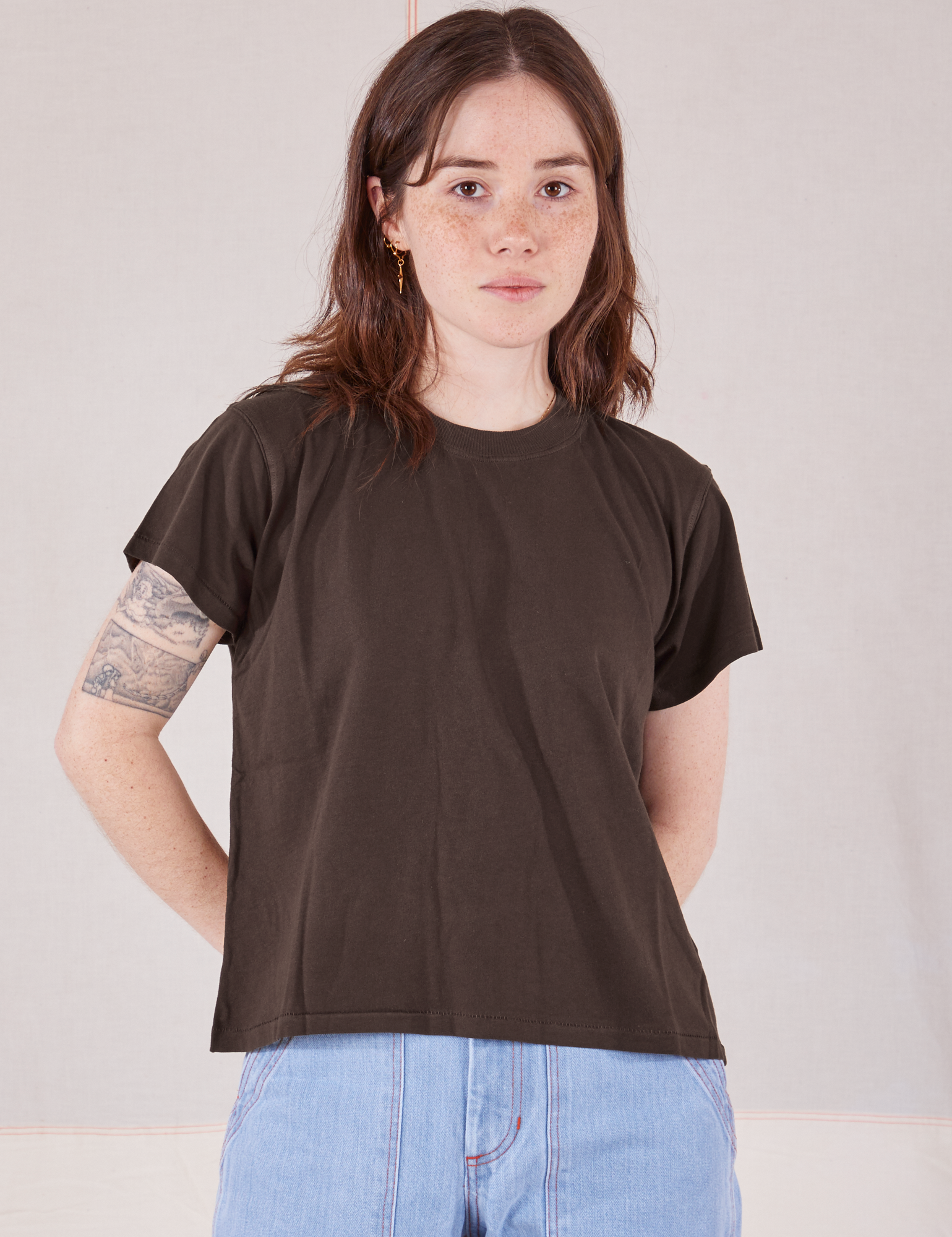Hana is 5'3" and wearing P Organic Vintage Tee in Espresso Brown