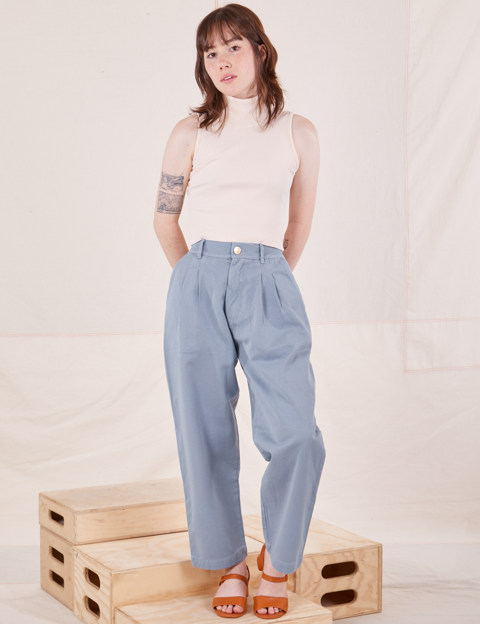 Hana is 5&#39;3&quot; and wearing XXS Petite Organic Trousers in Periwinkle paired with Sleeveless Turtleneck in vintage tee off-white