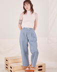 Hana is 5'3" and wearing XXS Petite Organic Trousers in Periwinkle paired with Sleeveless Turtleneck in vintage tee off-white