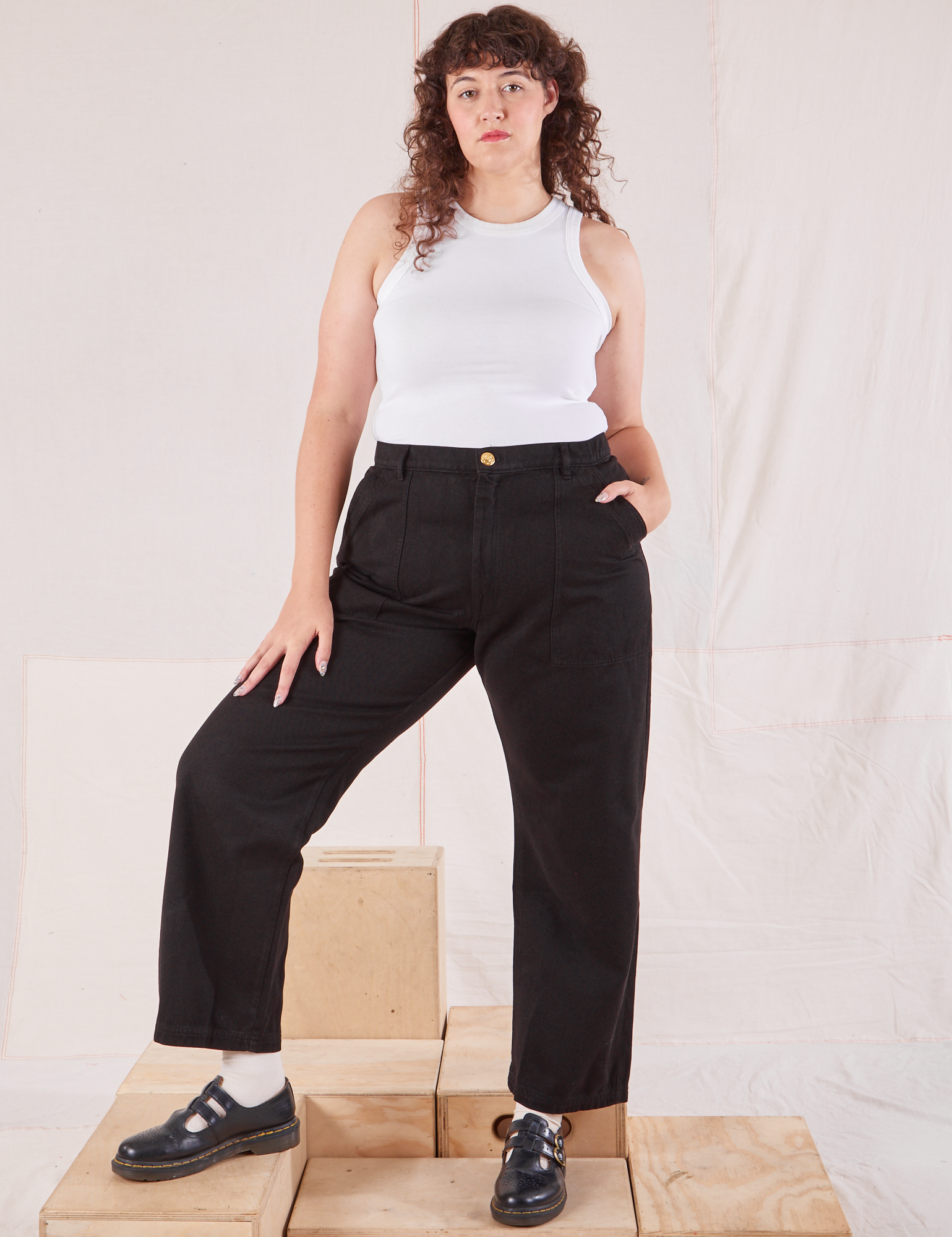 Ryan is 5'11" and wearing XL Organic Work Pants in Basic Black paired with Racerback Tank in vintage tee off-white